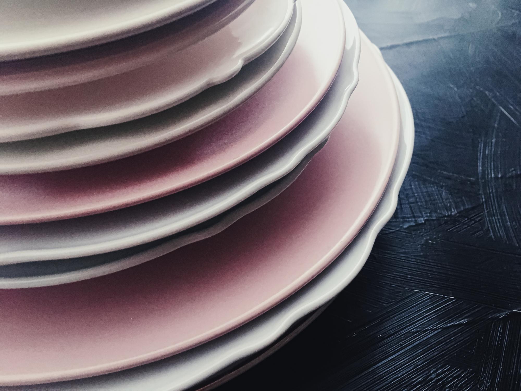 Stacked course manuals and a plated dish